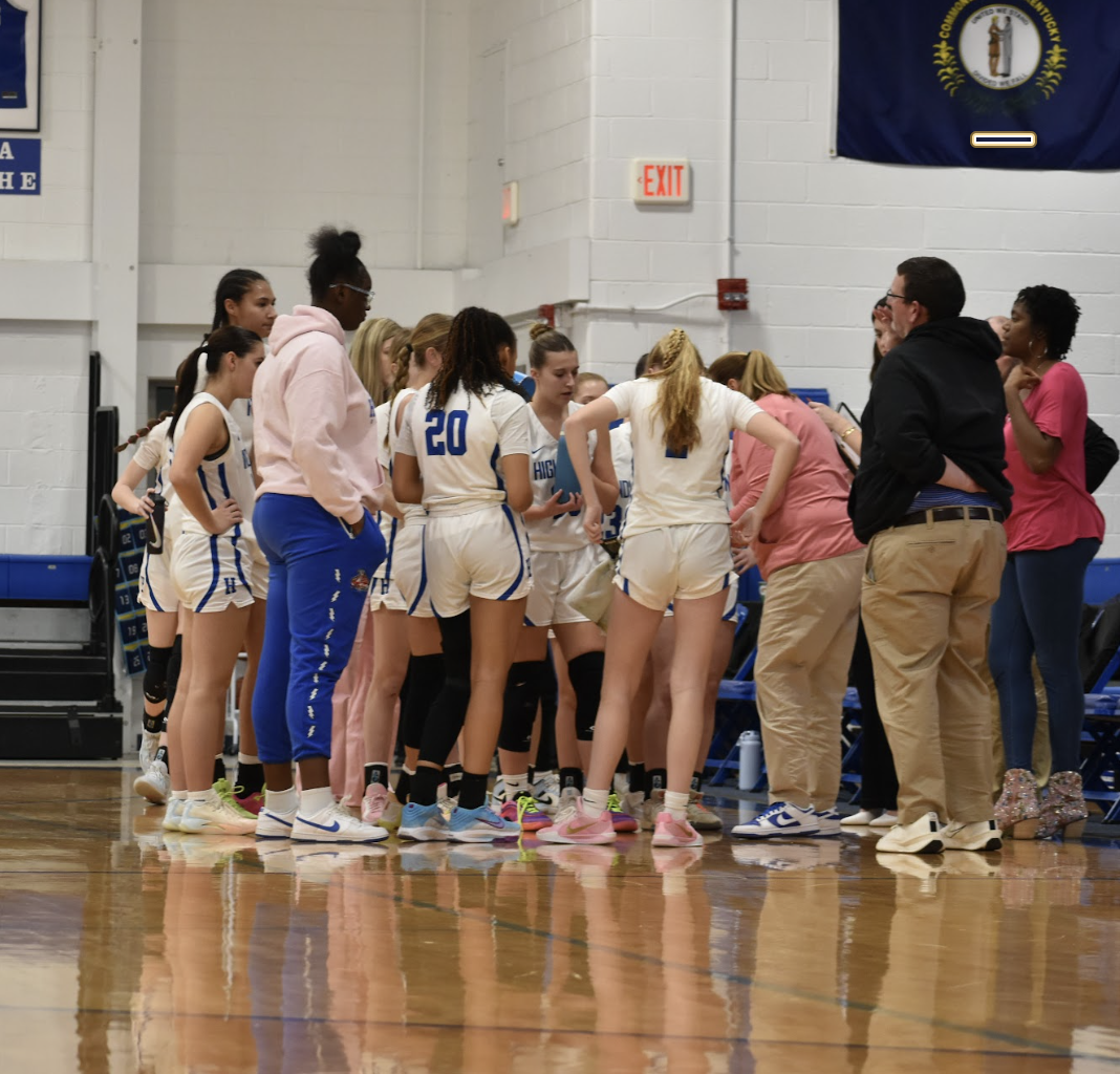 The team huddles up during a timeout. 